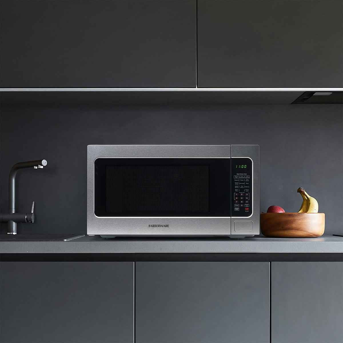 Farberware Countertop Microwave Ov 1100 Watts, 2.2 cu ft - Smart Sensor With LED Lighting and Child Lock - Perfect for Apartments and Dorms - Easy Clean Black Interior, Stainless Steel